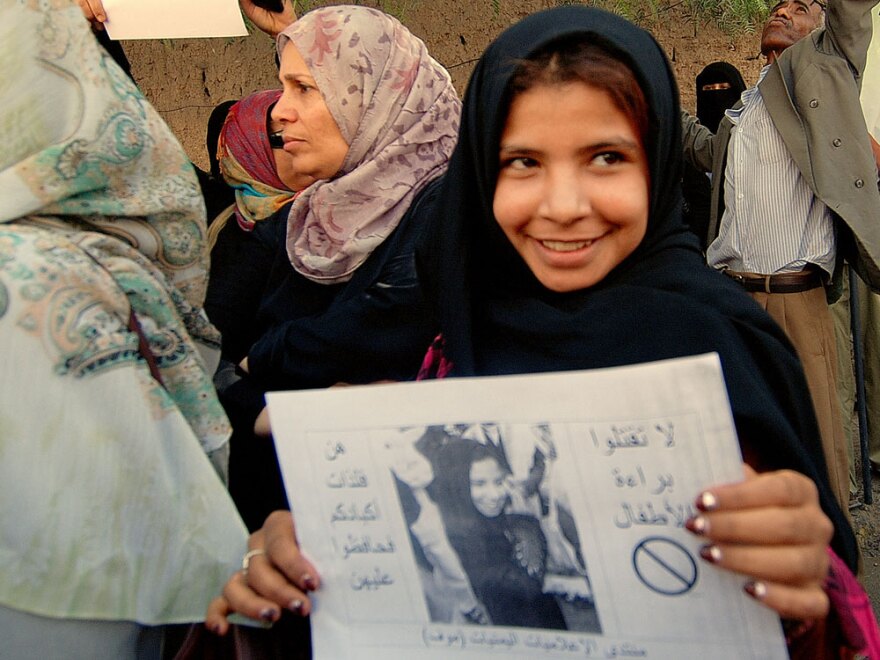 Nujood Ali, a former child bride in Yemen, demonstrates outside parliament in San'a, Yemen, on March 23 in support of proposed legislation banning the marriage of girls under 17. Ali was granted a historic divorce in 2008 at age 9 after her impoverished father forced her into an arranged marriage with a man 20 years older.
