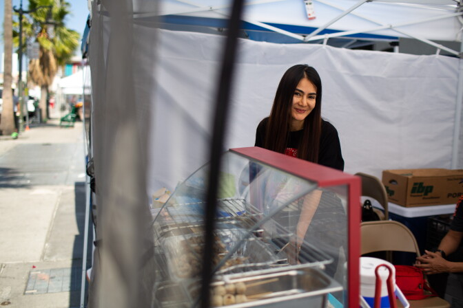 Iririn Sririda, the owner of a Thai food stall, So Zaap,  photographed at the East Hollywood Farmer's Market on Hollywood Boulevard on June 6, 2019 in Los Angeles, California. (James Bernal for KPCC)
