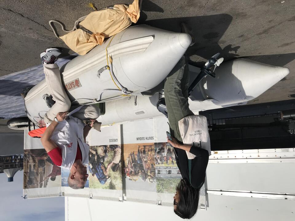 John Fiddler speaks with KPCC's Josie Huang at the boat that's meant to represent how displaced people would flee war-torn countries by sea. Fiddler says this boat would be a more luxurious example