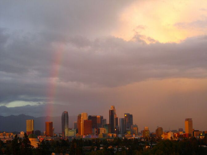 A rainbow, the result of scattered rains, crosses the Los Angeles sky in September, 2012.