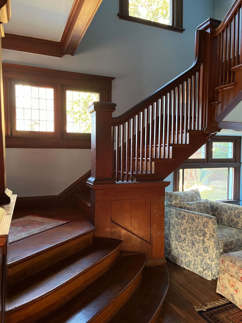 A wood staircase in a Victorian home.