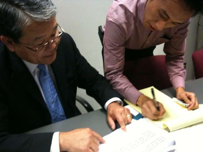 Los Angeles County Chief Executive Officer Bill Fujioka explains his proposed 2011-2012 budget to a reporter at a news briefing at the Hall of Administration.