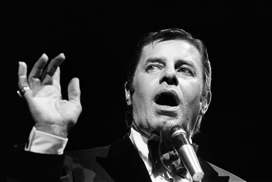 Jerry Lewis performs in Paris in 1976. Lewis, who appeared in dozens of films throughout his career, was perhaps nowhere more critically acclaimed than in France, where he earned the country's highest civilian honor.