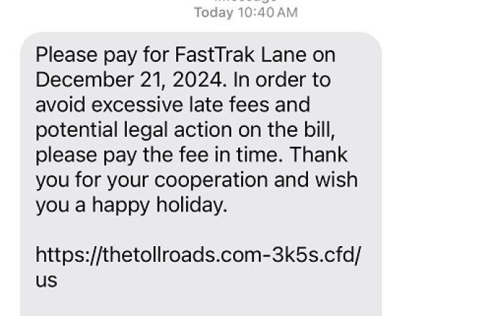 A screenshot of a scam text requesting the recipient pay an outstanding toll fee and sharing a fraudulent link.