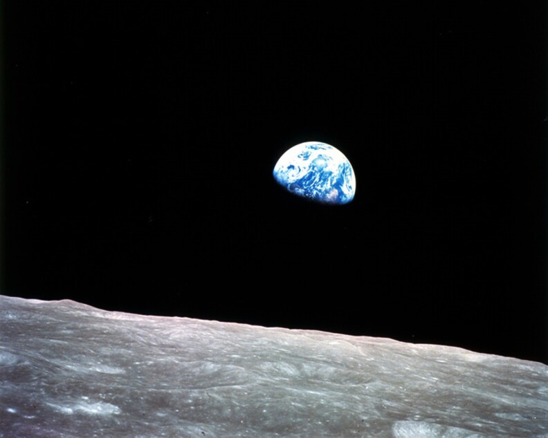 This photo shows an image of Earth from over the lunar horizon.