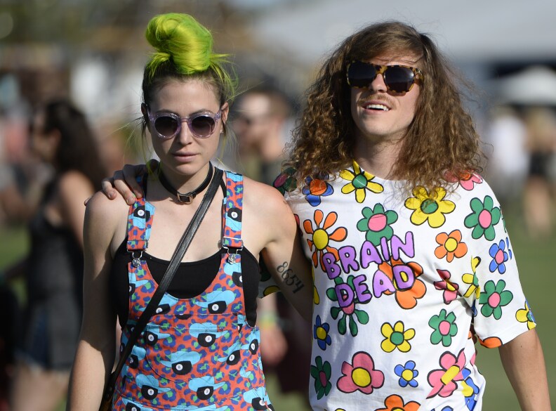 Actor Blake Anderson (R) and an unidentified guest attend the second day of the Coachella Music Festival in Indio, California, on April 11, 2015.  AFP PHOTO / ROBYN BECK        (Photo credit should read ROBYN BECK/AFP/Getty Images)