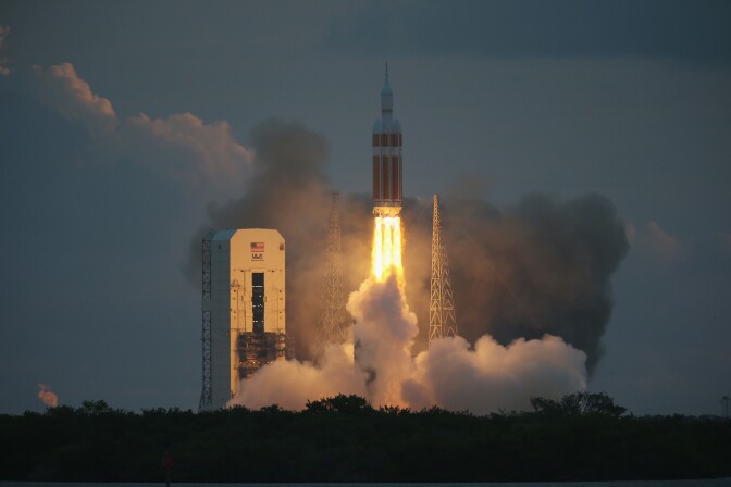 CAPE CANAVERAL, FL - DECEMBER 05:  The United Launch Alliance Delta 4 rocket carrying NASA's first Orion deep space exploration craft takes off from its launchpad on December 5, 2014 in Cape Canaveral, Florida.  The heavy-lift rocket will boost the unmanned Orion capsule to an altitude of 3,600 miles, and returning for a splashdown west of Baja California after a four and half hour flight.  .  (Photo by Joe Raedle/Getty Images)