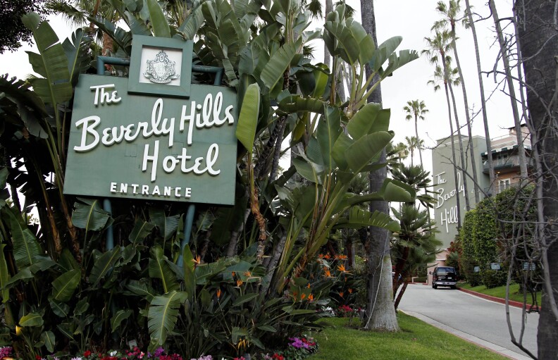 In this April 25, 2012 file photo, the entrance to the Beverly Hills Hotel is seen in Beverly Hills, Calif.  Hollywood is responding to harsh new laws in Brunei by boycotting the Beverly Hills Hotel. The Motion Picture & Television Fund joined a growing list of organizations and individuals Monday, May 5, 2014, refusing to do business with hotels owned by the Sultan or government of Brunei to protest the country’s new penal code that calls for punishing adultery, abortions and same-sex relationships with flogging and stoning.  