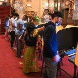 Voters casts their ballots at the Pantages Theatre polling station on November 3, 2020 in Los Angeles, California. - Americans were voting on Tuesday under the shadow of a surging coronavirus pandemic to decide whether to reelect Republican Donald Trump, one of the most polarizing presidents in US history, or send Democrat Joe Biden to the White House. (Photo by Robyn Beck / AFP) (Photo by ROBYN BECK/AFP via Getty Images)