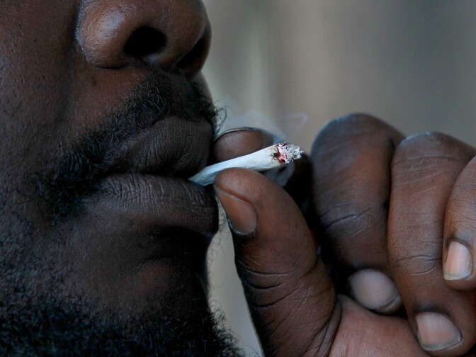 SAN FRANCISCO, CA - JULY 18:  A medical marijuana patient smokes marijuana during a protest outside of the State of California building on July 18, 2011 in San Francisco, California.  Medical marijuana patients and advocates held a demonstration outside of the State of California buildings in San Francisco and Los Angeles to express their concerns over a recent Drug Enforcement Agency memo that suggests that the DEA will reverse U.S. president Barack Obama's 2009 policy to not bring federal drug law prosecutions against individuals in compliance with state medical marijuana laws. Photo by Justin Sullivan/Getty Images)  (Photo by Justin Sullivan/Getty Images)