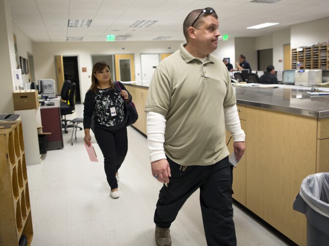 Grace Bescoby, left, a registered nurse and mental health counselor, and Police Officer Garett Bush work on MEU's System-wide Mental Assessment Response Teams.