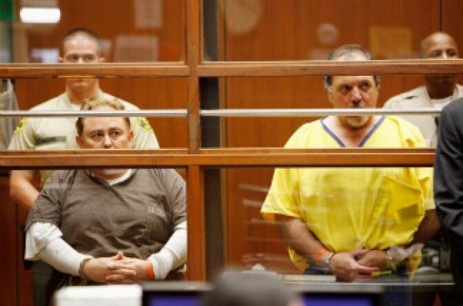 Former City of Bell, California Manager Robert Rizzo (L) and former City of Bell, California council member Victor Bello (R) appear in court with six other current and former City of Bell officials at Los Angeles County Criminal Courts September 22, 2010.