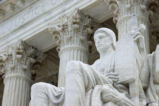 WASHINGTON, DC - JUNE 15: The statue Authority of Law by sculptor James Earle Fraser stands on the steps of the U.S. Supreme Court which ruled that LGBTQ people can not be disciplined or fired based on their sexual orientation June 15, 2020 in Washington, DC. With Chief Justice John Roberts and Justice Neil Gorsuch joining the Democratic appointees, the court ruled 6-3 that the Civil Rights Act of 1964 bans bias based on sexual orientation or gender identity. (Photo by Chip Somodevilla/Getty Images)