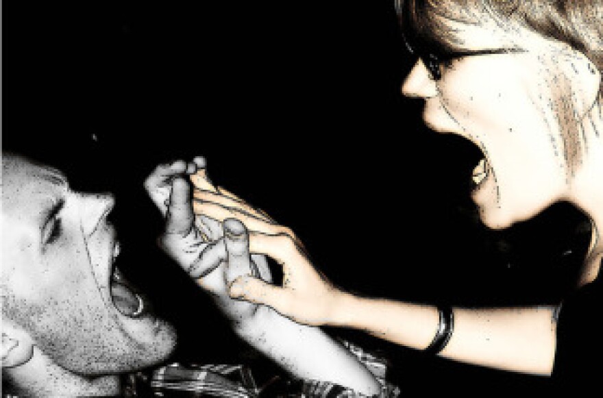 Two adults getting angry at one another