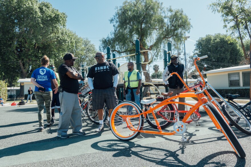 Members of Los Riders and the East Side Riders Bike Club stop by a service project by The Mission Continues at Gonzaque Village in Watts.