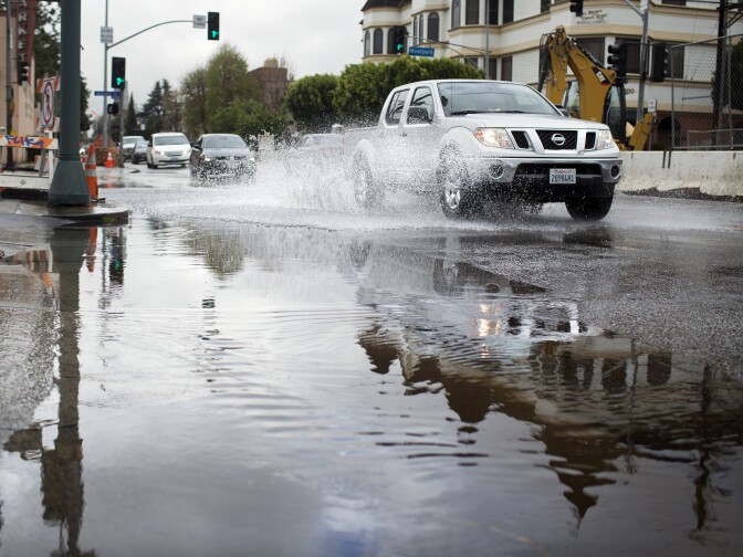 Rainwater floods Coldwater Canyon Avenue and Moorpark Street in Studio City on Friday morning, Feb. 28 after an overnight storm in Southern California.