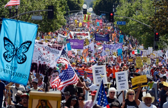 LOS ANGELES, CA - MAY 01:  Thousands of people participate in the May Day march and rally on May 1, 2013 in Los Angeles, California. Labor organizations and immigration groups used the annual celebration to push for an immigration system overhaul.  (Photo by Kevork Djansezian/Getty Images)