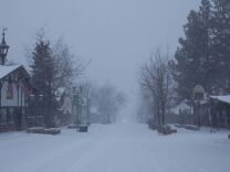Snow falls at Bear Mountain Ski Resort where police are continuing the hunt for Christopher Dorner, suspected of killing three people in Southern California.
