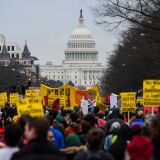 TOPSHOT - Anti-war activist march from the White House to the Trump International Hotel in Washington, DC, on January 4, 2020. - Demonstrators are protesting the US drone attack which killed Iran's Major General Qasem Soleimani in Iraq on January 3, a dramatic escalation in spiralling tensions between Iran and the US, which pledged to send thousands more troops to the region. (Photo by ANDREW CABALLERO-REYNOLDS / AFP) (Photo by ANDREW CABALLERO-REYNOLDS/AFP via Getty Images)