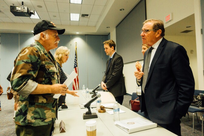 Navy veteran Charles Boyd Hanlon (left) speaks to Rep. Neal Dunn (R-FL), the chairman of the House VA Subcommittee on Health. 