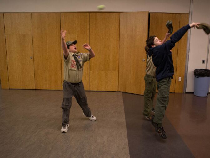 Boy scouts toss a tennis ball around before a meeting of Boy Scout Troop 36 at Beth Hillel Temple in North Hollywood.