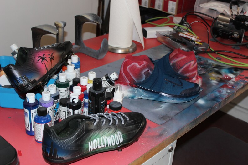 Wes Burton's workspace for his custom cleat business he runs out of his family garage.