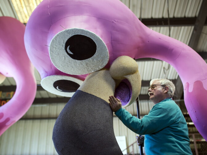 Volunteer David Gaydosh of Hawthorne patches poppyseed onto a bird beak at Sierra Madre Rose Float Association's barn on Tuesday morning, Dec. 29, 2015. The birds are part of a float for the 2016 Rose Parade on New Year's Day.