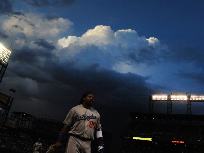 Los Angeles Dodgers Manny Ramirez walks to the dugout with stormy weather in the backgground of game against the Colorado Rockies Saturday, May 29, 2010 at Coors Field in Denver, Colorado...© Jon SooHoo/ Los Angeles Dodgers 2010