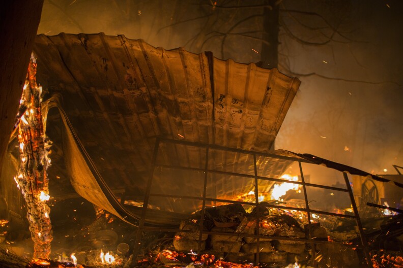 SONOMA, CA - OCTOBER 14: A structure burns in the early morning hours on October 14, 2017 in Sonoma, California. At least 32 people are confirmed dead with hundreds still missing. Officials expect the death toll to rise, and now estimate that 5,700 structures have been destroyed. (Photo by David McNew/Getty Images)