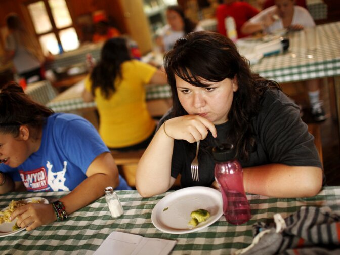 Healthful dieting is more than half the battle. Every calorie and gram of fat is strictly monitored by the staff at Wellspring and carefully recorded by the students. Here, Savannah Davis finishes her dinner with broccoli.