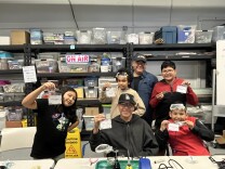 A group of kids show off their home-made ham radios.