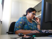 Nasima Rahi, a certified educator for California Covered, shares information about the Affordable Care Act with visitors to Asian Pacific Health Care Venture.  