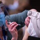 Advanced registered nurse practitioner Erin Forsythe administers the COVID-19 vaccine in Seattle, Washington. 