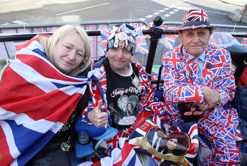 WINDSOR, ENGLAND - MAY 17: Royal fans John Loughrey (C) and Terry Hutt (R) pose for a photograph ahead of the dress rehearsal for the wedding of Prince Harry and Meghan Markle on May 17, 2018 in Windsor, England.  (Photo by Chris Jackson/Getty Images)