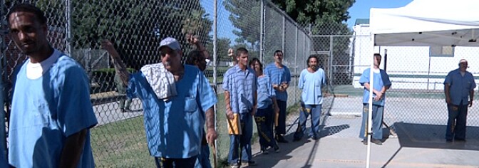 Prisoners at the California Institution for Men in Chino line up, waiting for medical appointments.