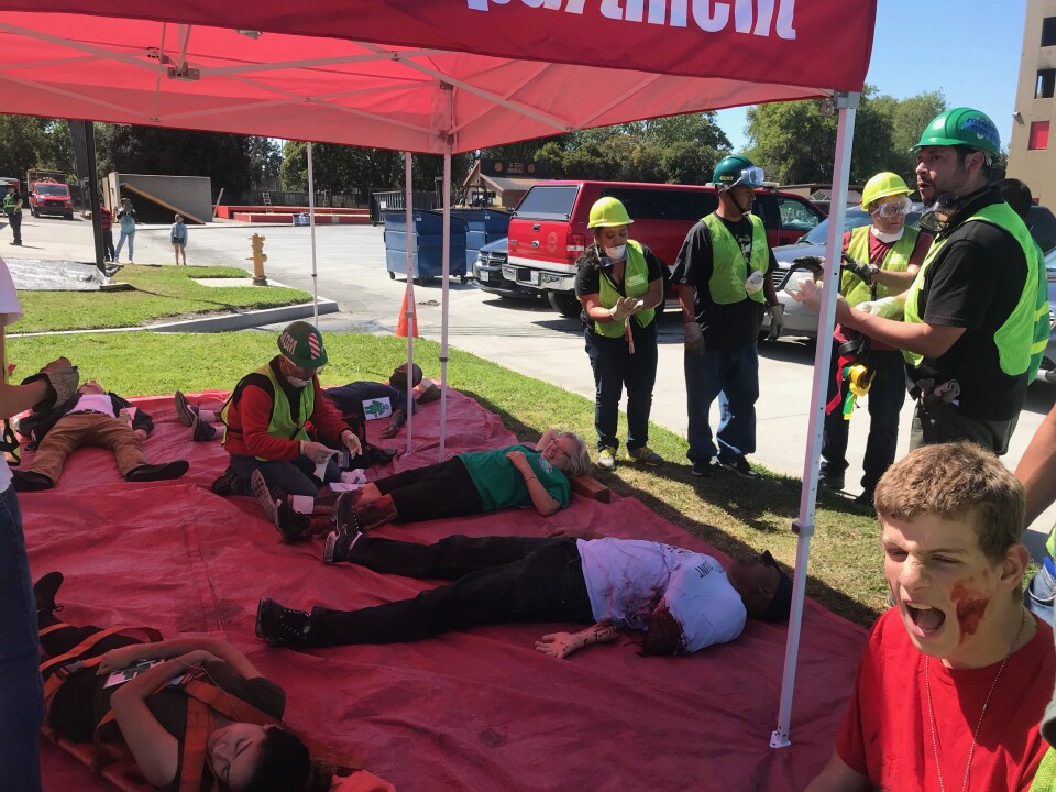 Volunteer victims lay in the triage tent. One man is missing an arm and another woman has second-degree burns on her legs. Photo credit: Audrey Alden