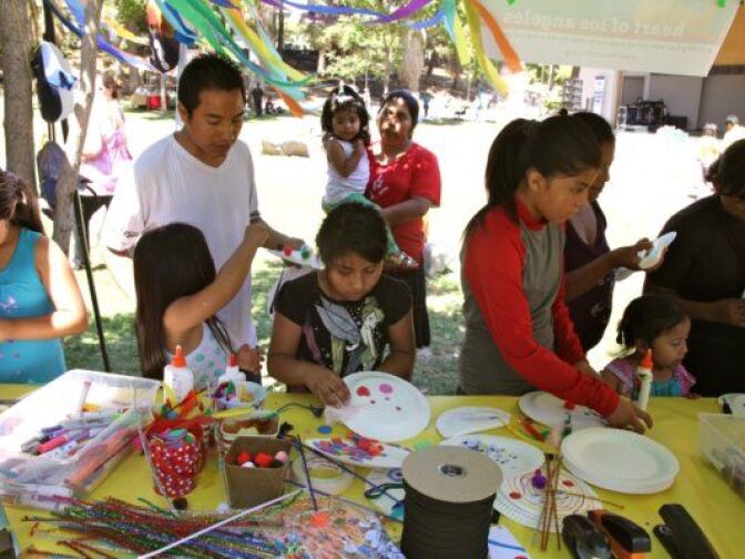 HOLA students painting their mask