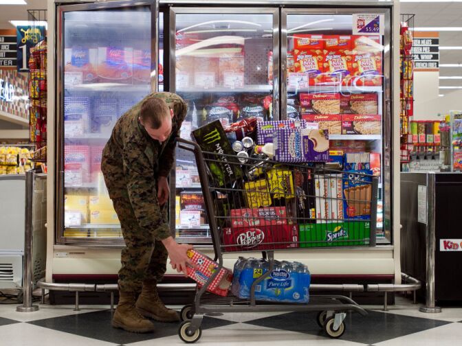 The Camp Pendleton commissary remains open on Tuesday, in order to sell off perishable goods. But base officials expect it to close by Wednesday. A customer loads his cart with drinks at the Commissary at Camp Pendleton on Jan. 24, 2013. With the help of government subsidies, prices at military grocery stores are an average of 30 percent less than at commercial stores.