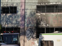 OAKLAND, CA - DECEMBER 03:  Charred windows on the face of a building that was the scene of a overnight fire that claimed the lives of at least nine people at a warehouse in the Fruitvale neighborhood on December 3, 2016 in Oakland, California. The warehouse was hosting an electronic music party.  (Photo by Elijah Nouvelage/Getty Images)