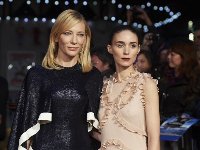 Australian actress Cate Blanchett (L) and US actress Rooney Mara pose on arrival for a gala screening of the movie "Carol." 