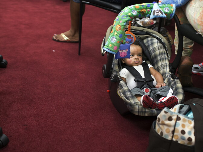 Four-month-old King Ace sits next to mother Shemera Williams during the social support and empowerment class on Monday Feb. 23.