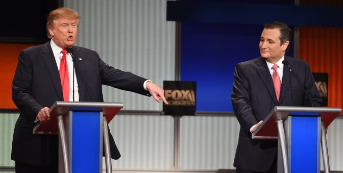 Republican presidential candidate, businessman Donald Trump speaks as Republican presidential candidate, Sen. Ted Cruz, R-Texas, looks on during the Fox Business Network Republican presidential debate at the North Charleston Coliseum, Thursday, Jan. 14, 2016, in North Charleston, S.C. (AP Photo/Rainier Ehrhardt)