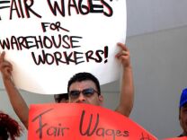 Warehouse workers rally in Riverside after announcing a class action lawsuit against a Wal-Mart warehouse operated by Schneider Logistics.
