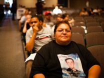 Orange County prosecutors Tuesday said an Anaheim police officer was legally justified when he shot and killed Joel Acevedo, 22, last year. The shooting of Acevedo and Manuel Diaz sparked violent protests in the city. (File photo: Genevieve Huizar, mother of Manuel Diaz, waits to speak at the Anaheim City Council meeting on August 8, 2012. After an unarmed Diaz was killed by Anaheim police in July, the community erupted in protest).