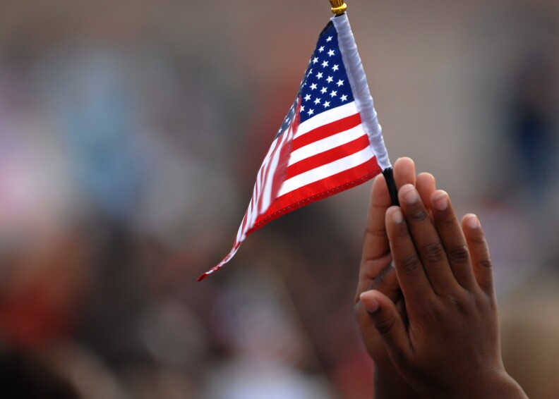 A student from Trimmier Elementary School waves his flag during a 9/11 remembrance ceremony, Sept. 10. The children all had a flag which they waved throughout the mornings events. After multiple presentations and performances by the schools choir, soldiers from 4th Attack Reconnaissance Battalion, 227th Aviation Regiment, 1st Air Cavalry Brigade, 1st Cavalry Division, walked around school with the students and faculty during their annual Freedom Walk. 