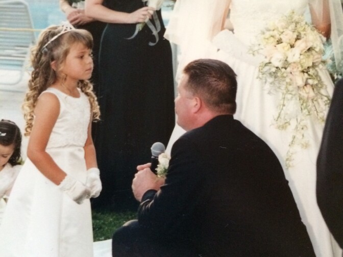 "The second photo, also taken at the wedding, captured Steve on one knee giving symbolic vows to his daughter Shannon, just before giving vows to her mother Tania.  It was the kind of person he was, always thoughtful of others feelings and emotions before his own. "
