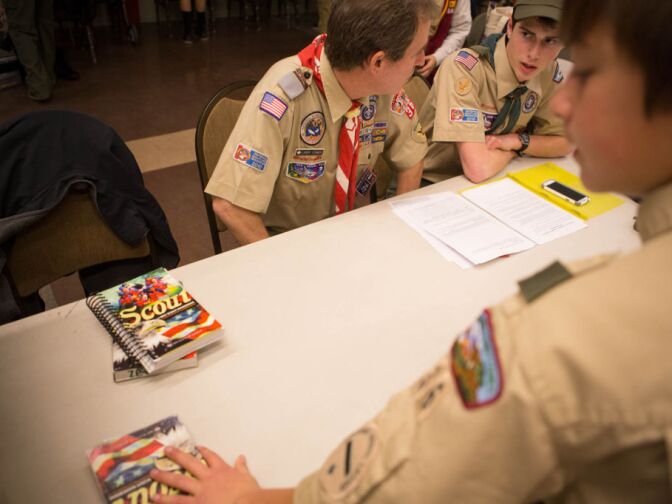 Brandon Lampert, right, receives some advice on how to complete a project from Scoutmaster Larry Turner.
