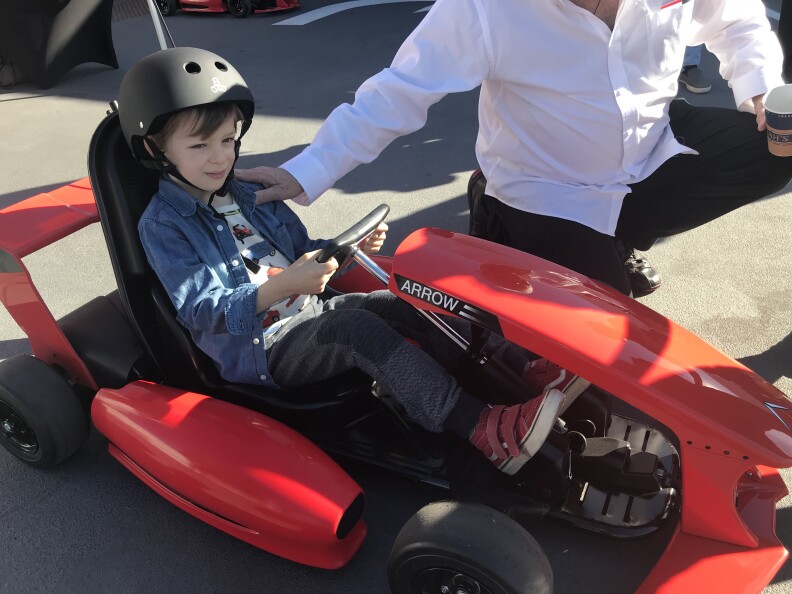 Lewis Oliver prepares to go driving in a go-kart at the Petersen Automotive Museum