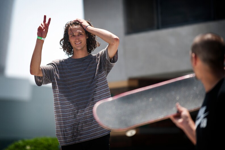 Skateboarder Evan Smith greets the crowd during the final round of Street League Skateboarding on Thursday during the first day of the X Games.