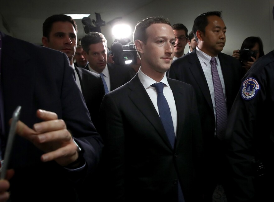 WASHINGTON, DC - APRIL 09:  Facebook CEO Mark Zuckerberg (C) leaves the office of Sen. Dianne Feinstein (D-CA) after meeting with Feinstein on Capitol Hill on April 9, 2018 in Washington, DC. Zuckerberg is meeting with individual senators in advance of tomorrow's scheduled hearing before the Senate Judiciary and Commerce committeees. Zuckerberg is under pressure to explain why tens of millions of Facebook user's private information was shared with Cambridge Analytica. (Photo by Win McNamee/Getty Images)